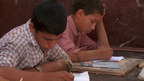 KABUL, AFGHANISTAN - CIRCA 2009: Boys study in a school circa 2009 in Kabul, Afghanistan. Afghanistan is an impoverished and least developed country, one of the world's poorest.  