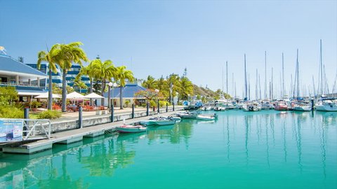 NOUMEA, NEW CALEDONIA - 2016: Port Moselle Marina Waterfront with Restaurants Facing Turquoise Sea Water Filled with Recreational Boats and Yachts