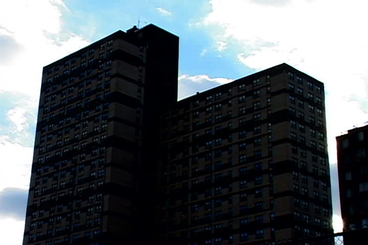Clouds drifting behind two skyscrapers
