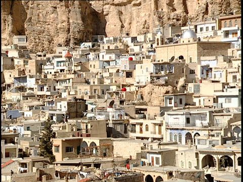 Maaloula, Syria - 2005 - Static shot of tightly clustered houses built into a mountainside.