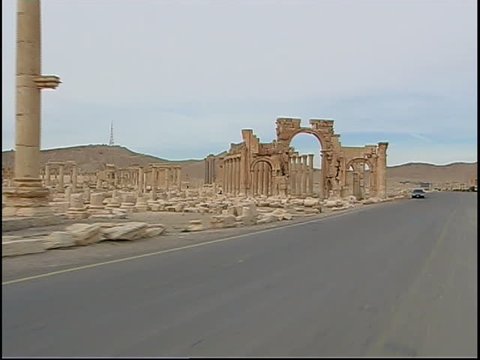 Palmyra, Syria - 2005 - Travelling shot on a road leading to the ancient site of Palmyra in the Syrian desert. Palmyra is a UNESCO World Heritage Site.