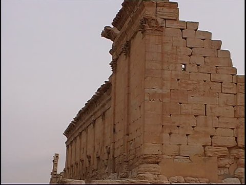 PALMYRA, SYRIA - CIRCA 2004: Pan right across the ruins of the temple of Bel in the ancient city of Palmyra. The temple was destroyed by ISIS in 2015. Palmyra is a UNESCO World Heritage Site