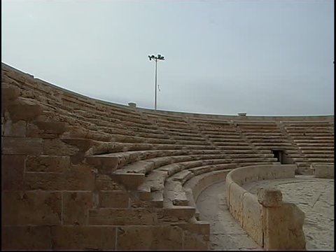 Palmyra, Syria - 2005 - Pan right from the cavea or seating section to the stage of the Roman Theatre in Palmyra. The theatre dates back to the second-century BCE.