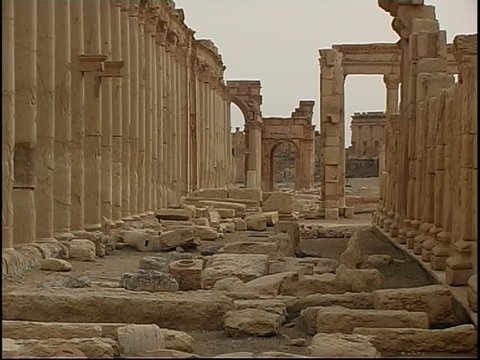 Palmyra, Syria - 2004 - Tilt down on the Great Colonnade in the ruins of Palmyra. Palmyra is a UNESCO World Heritage Site.