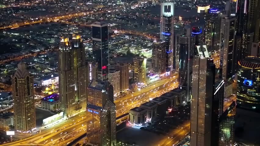 Dubai downtown at night, United Arab Emirates. View on Sheikh Zayed road from the 124th floor of Burj Khalifa skyscraper in Dubai, currently the tallest structure in the world, 829,8 m or 2,722 ft