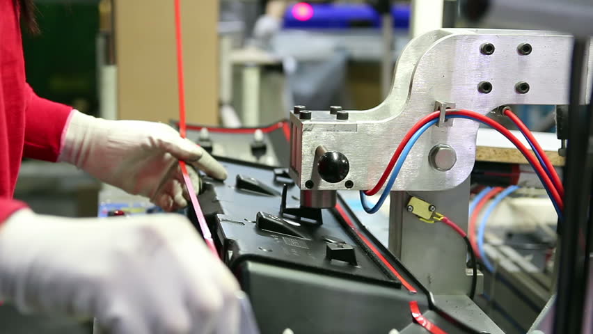 Automobile Factory Worker On Assembly Line. Automotive industry.
Plastic Car Interior Components Manufacturing. 