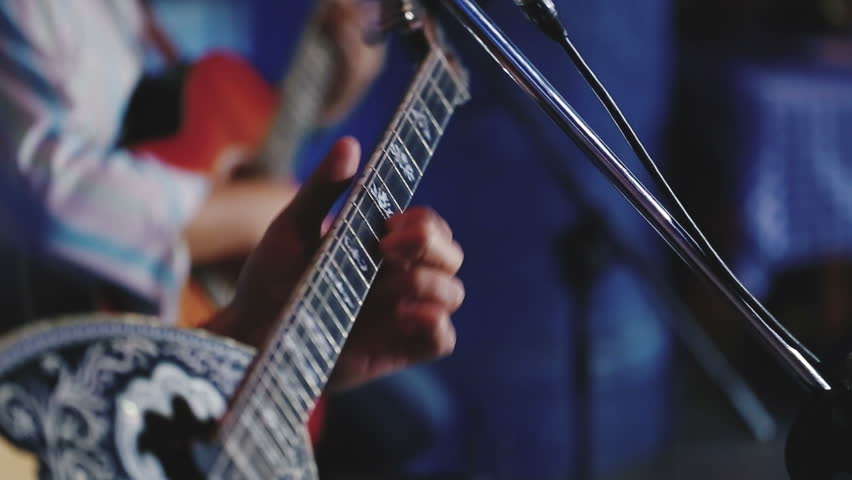 Guitarists  playing guitar and  bouzouki.