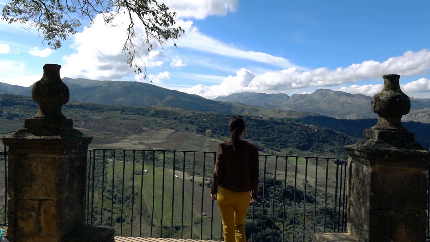 Woman admire beautiful landscape from the view point terrace, super slow motion
