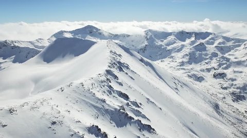 Aerial Flight Over Mountain Range Beautiful Swiss Alps Sun Shining Over Clouds Horizon Bird'S Eye Background UHD 4K