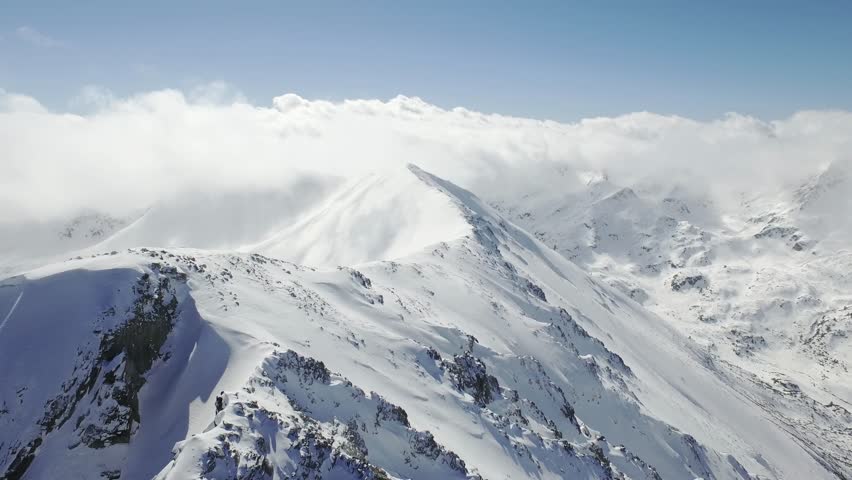 Beautiful Winter Aerial Flight Over Mountain Chain Landscape Swiss Alps Adventure Hiking Trekking Ski Vacation Travel Concept UHD 4K