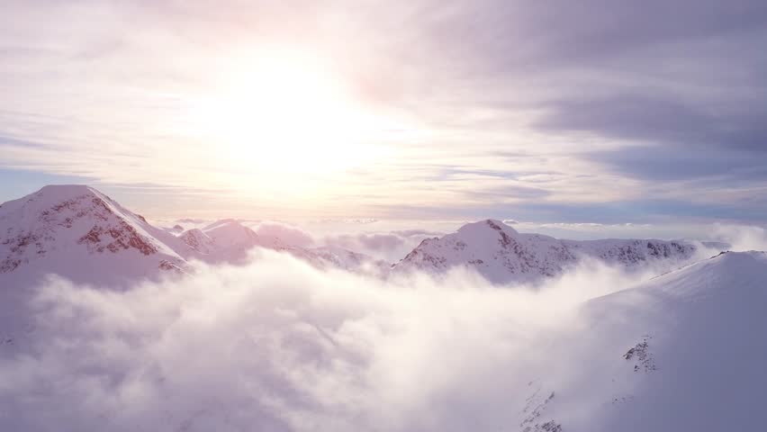 Epic Aerial Flight Through Mountain Clouds Towards Sunrise Beautiful Morning Peaks Inspirational Motivational Nature Background UHD 4K Royalty-Free Stock Footage #15072076