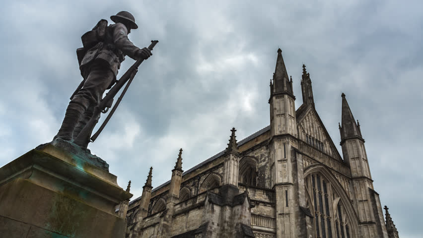 Winchester Cathedral time-lapse with fast clouds in winter. Slow tilt up.
