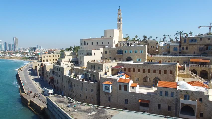 Aerial footage of the old city of Jaffa and tel Aviv skyline