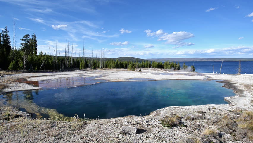 Abyss Pool with a beautiful blue sky at the West Thumb Geyser Basin in Yellowstone National Park