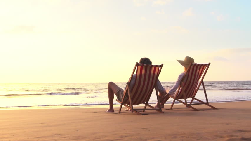Retirement Vacation Concept, Happy Mature Retired Couple Enjoying Beautiful Sunset at the Beach. SLOW MOTION
 Royalty-Free Stock Footage #15077590