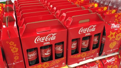 VUNG TAU, VIETNAM - FEBRUARY 6, 2016: A view at stacked red gift boxes with coca cola bottles at a Lotte Mart supermarket. Tet, Lunar New Year, is the biggest holiday in Vietnam. 