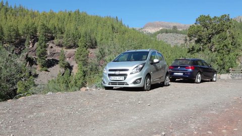TENERIFE, SPAIN-CIRCA JAN, 2016: Small lay-by space is on ground road for car parking. Tourists leave their vehicles for walk hiking route to Paisaje Lunar (Lunar Landscape)