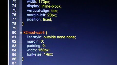 Hexadecimal code running up a computer screen. Webmaster css coding. Close-up shot. Shallow depth of field.