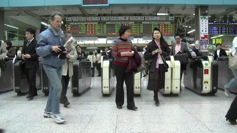 TOKYO - CIRCA 2009: 
(Timelapse View) Commuters pass through the turnstiles in Ueno station during rush hour circa 2009 in Tokyo, Japan.

