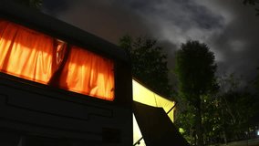 Time Lapsing of trailer home at night, adventure travel concept