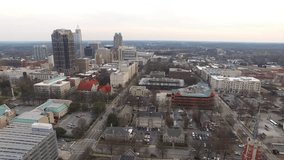 Aerial footage over downtown Raleigh, NC in the late afternoon.
