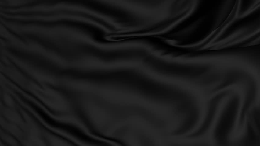 A background texture of soft rippled black fabric textile material