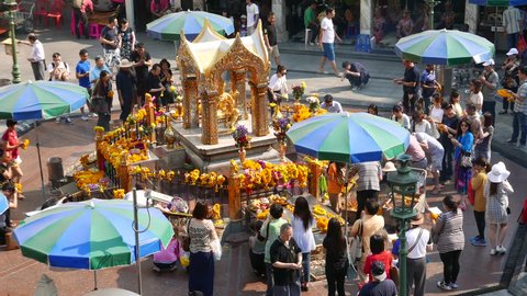 BANGKOK,THAILAND - 5/3/2016 :  Unidentified people pray respect the famous Erawan shrine at Ratchaprasong Junction on 2016 in Bangkok capital city,Thailand