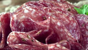 Portion of rotating Salami as not seamless loopable 4K UHD footage