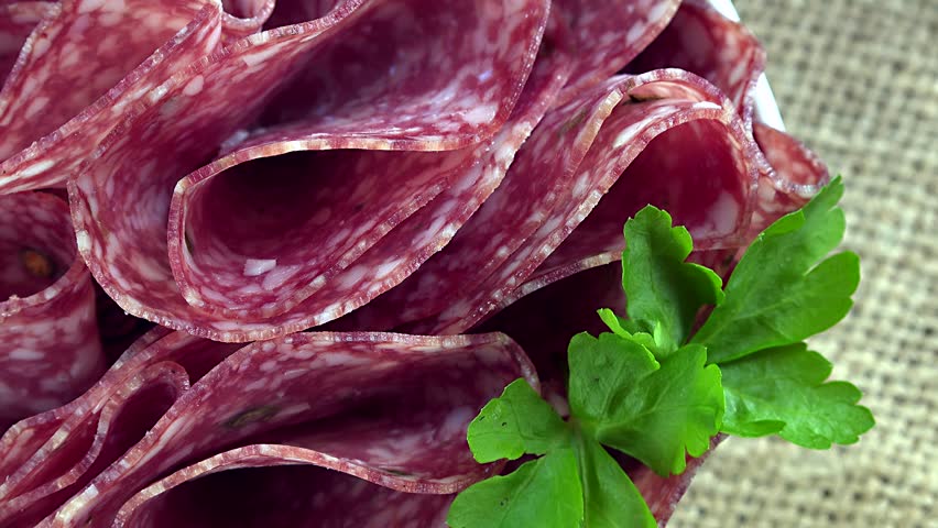 Rotating Salami as not seamless loopable 4K UHD footage (close-up scene)