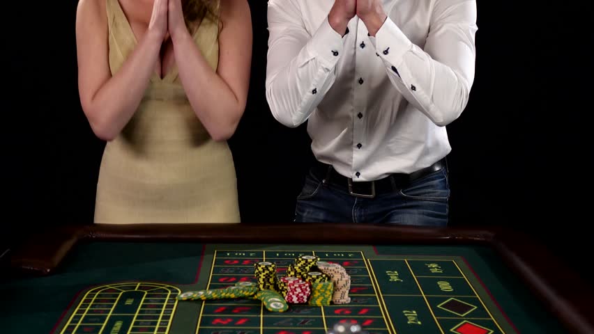Couple celebrates victory at the casino. Black 
