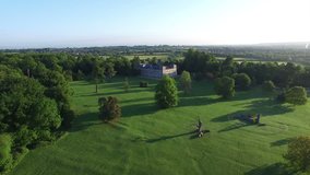 4K Aerial flight above agricultural area and greenery in the countryside UK -- July, 2015