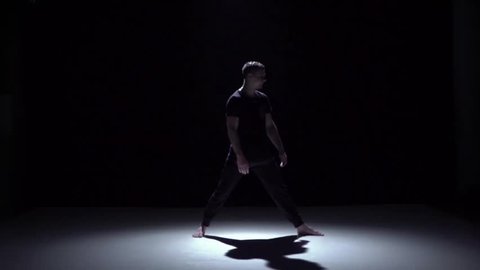 Start graceful contemporary dance of couple dancers on black, shadow, slow motion