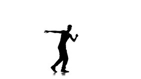 Young man dancing breakdance on one hand, white, silhouette, slow motion