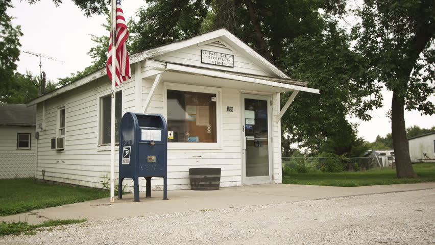 Rural Post Office with the American flag in a midwestern small town. 