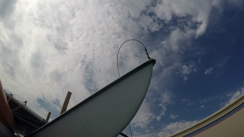 Boat with clouds time lapse