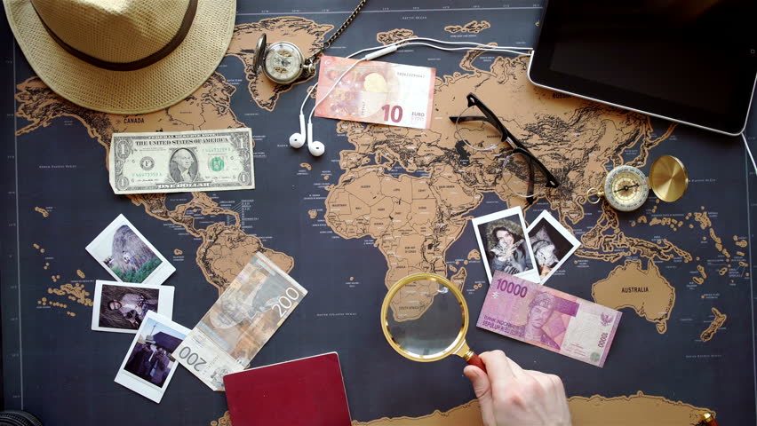 Two young people together planning trip to Europe. Top view.