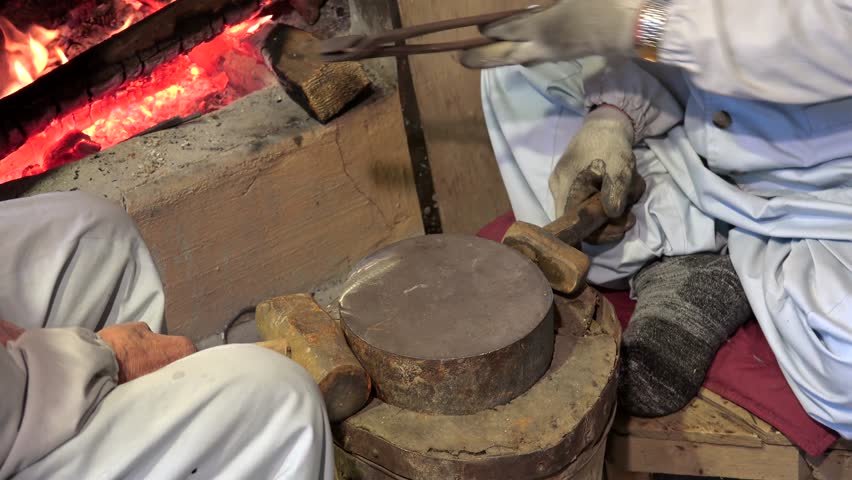 Craftsmen works in the blacksmith workshop at Korean Folk Village. Seoul, South Korea