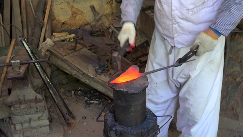 Craftsmen works in the blacksmith workshop at Korean Folk Village. Seoul, South Korea