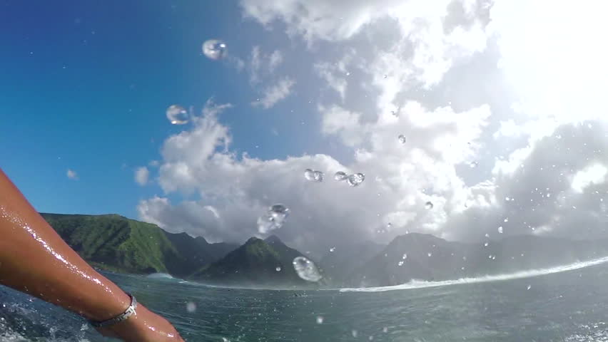 FPV SLOW MOTION: Pro surfer paddling and surfing big barrel wave Teahupoo in famous surf spot in sunny Tahiti island Royalty-Free Stock Footage #15149824