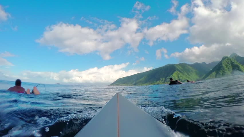 FPV SLOW MOTION: Pro surfer paddling and catching big barrel wave Teahupoo in famous surf spot in sunny Tahiti island Royalty-Free Stock Footage #15149830