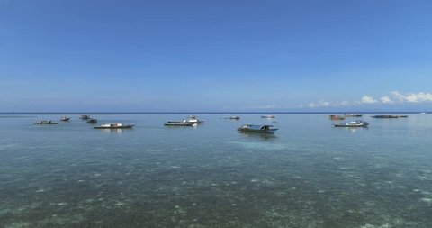 Timelapse of daily life of seagypsy in open sea with sunny day and blue sky in Mabul Sipadan island located in Semporna, Sabah, Malaysia.