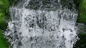 Beautiful waterfall in nature in slow motion, Power of Nature - Magnificent Waterfall in Closeup in a Beautiful Nature, Slow Motion Video Clip