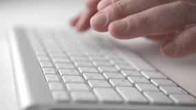 Man's hands typing on the silver laptop keyboard. Close view Full HD video