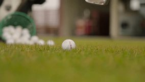 Slashing at the ball in a golf closeup.