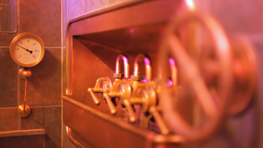 Shooting of numerous knobs, faucets, pipes in the brewery