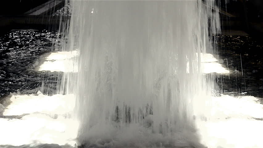 Water falling down a fountain bursting massive amounts of water