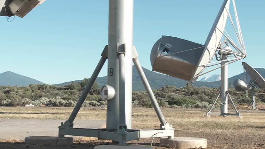 A tilt up to the moon as a satellite searches for extra terrestrial life.
