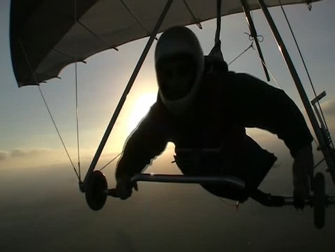 Hang glider pilot in silhoutte