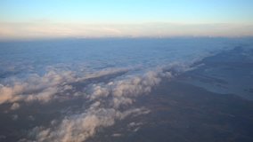 4k aerial video of cloudy sky in Sweden from airplane.