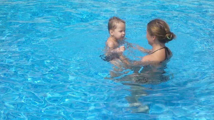 Mother with her son in the pool | Shutterstock HD Video #15187156